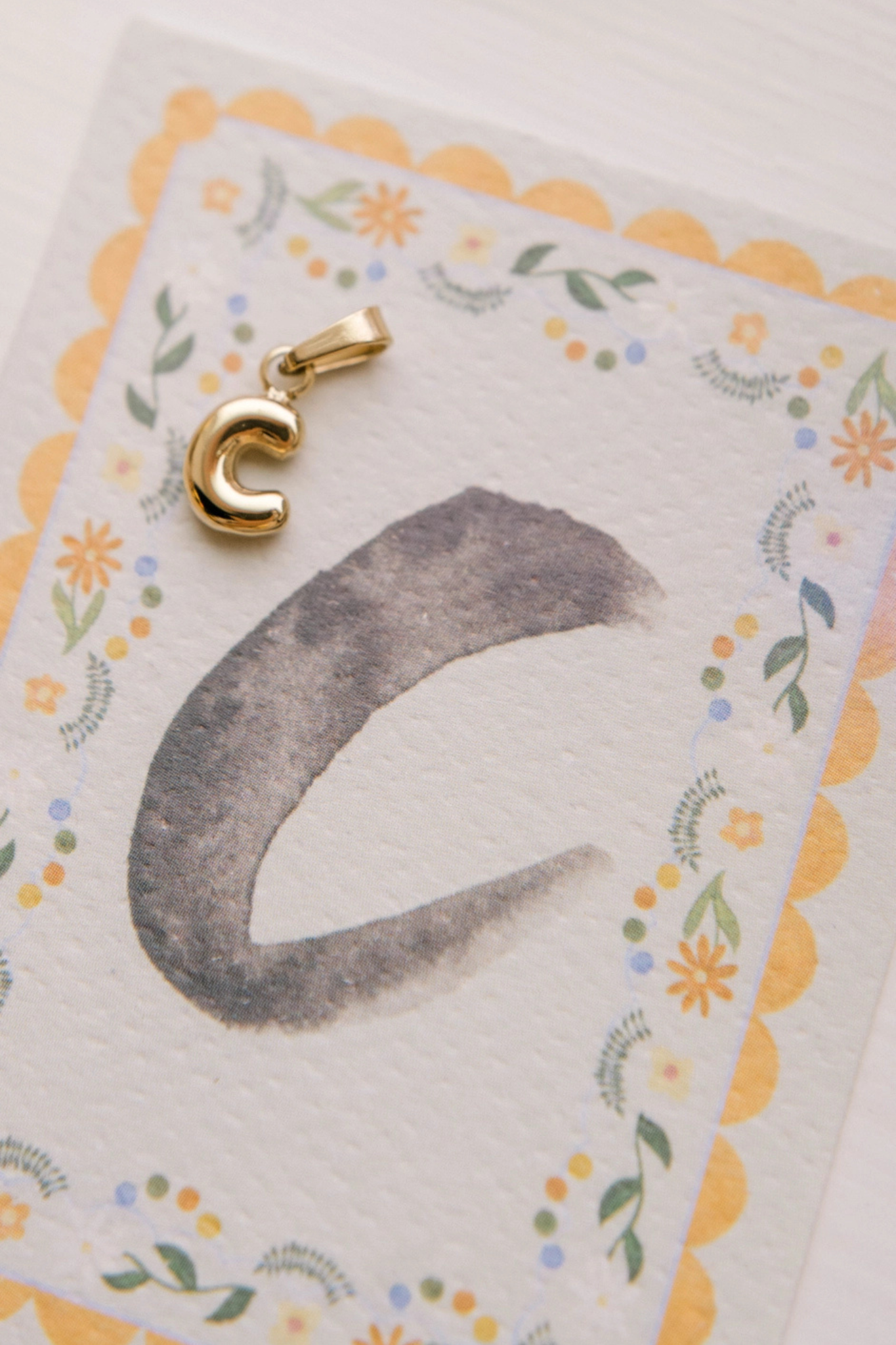 C - Letter Charm